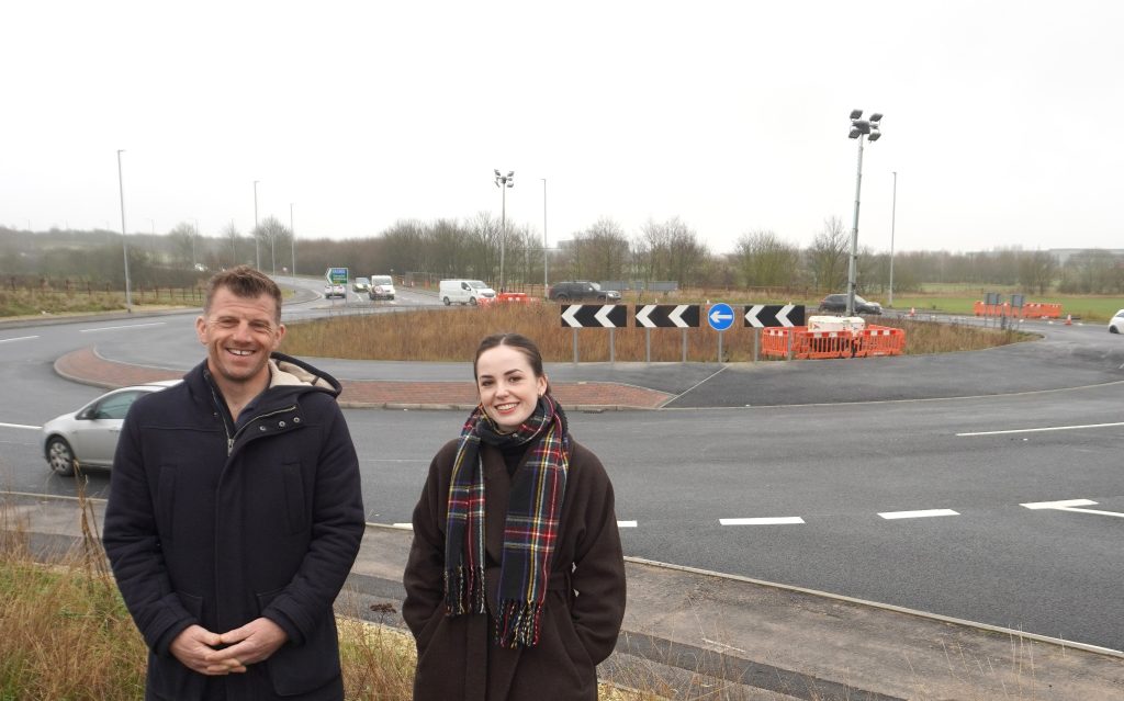 Artists Dan Jones and Ailish Treanor pictured in front of the roundabout